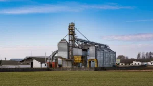 Agricultural silos and processing infrastructure representing renewable fuel feedstock supply.