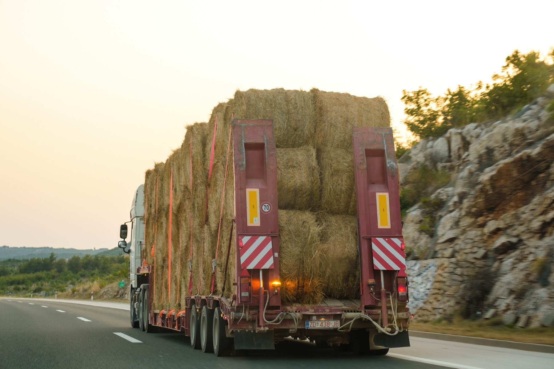 Truck transporting biomass bales for feedstock logistics planning