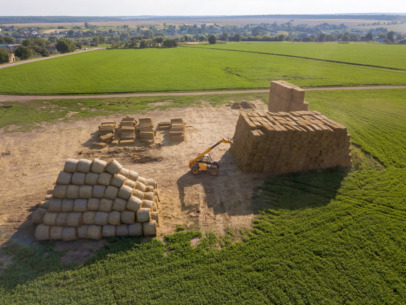 Agricultural field with haystacks used for land deployment case context