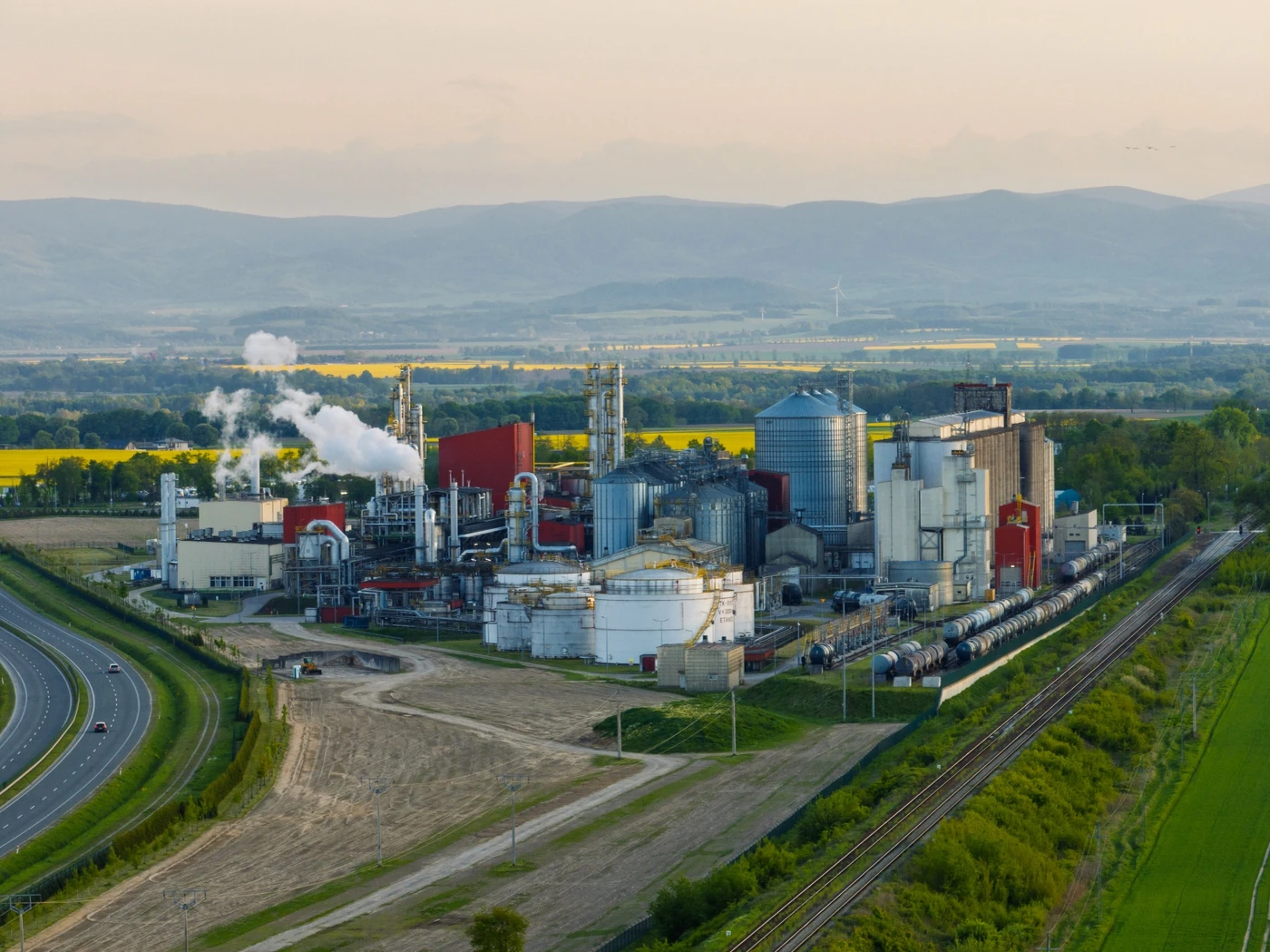 Commercial ethanol and biofuel processing complex surrounded by agricultural land